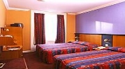A twin room at Corona Hotel London