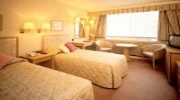 A comfortable twin room at Copthorne Tara Hotel Kensington